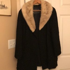 Lamb’s wool fur coat with mink collar.